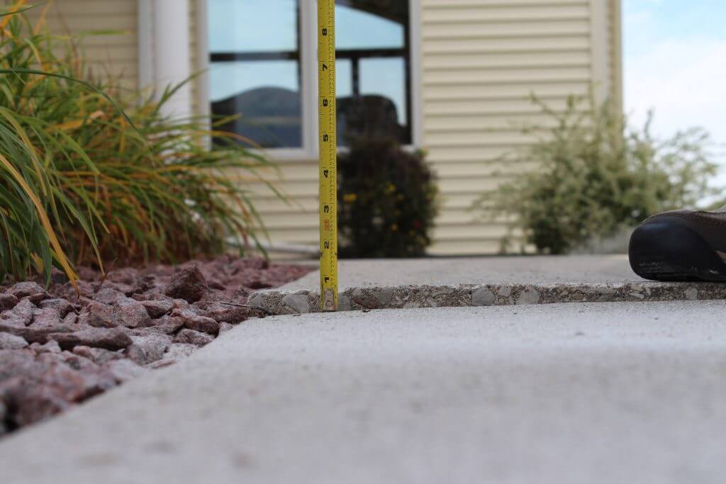 sunken concrete sidewalk