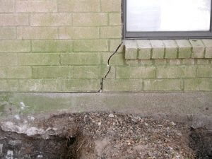vertical cracks in brick near window