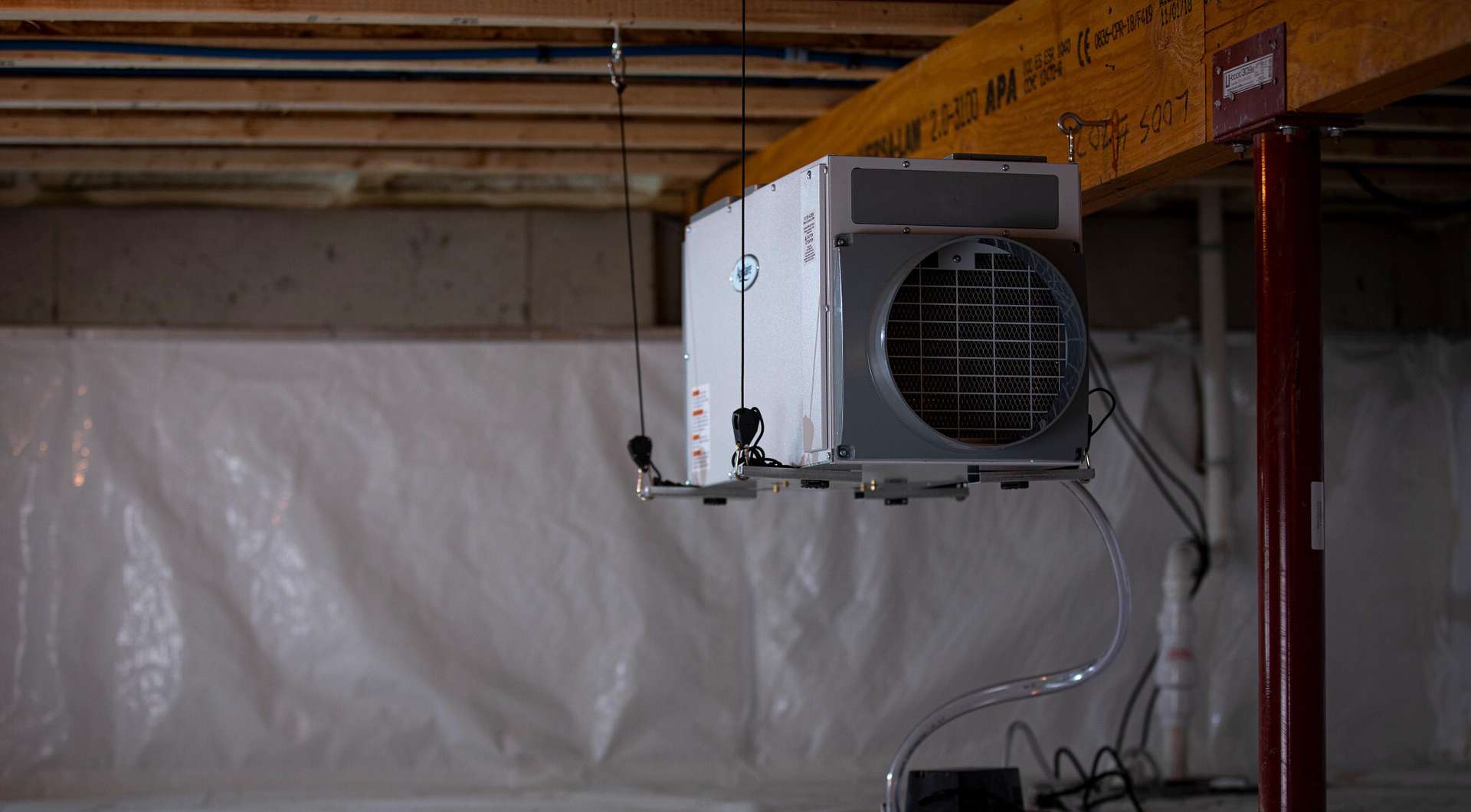 crawl space dehumidifier installed with encapsulation vapor barriers