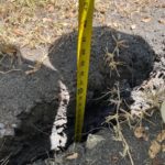 crack in soil due to drought conditions