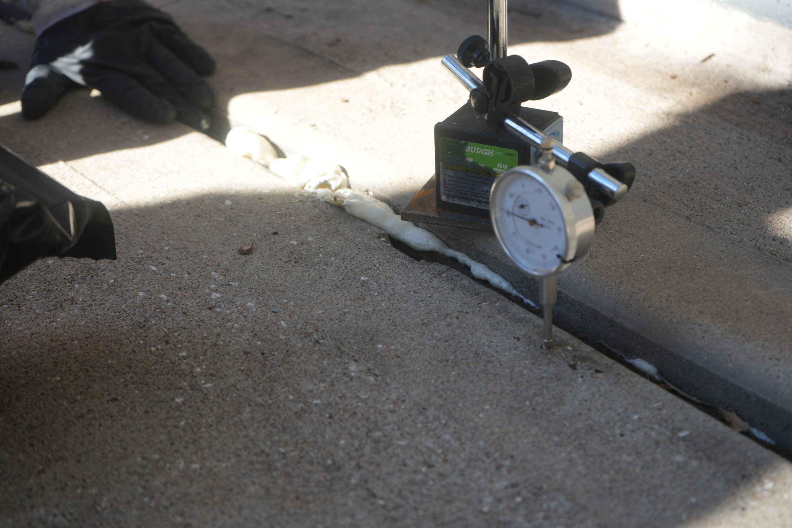 Concrete near garage door - uneven