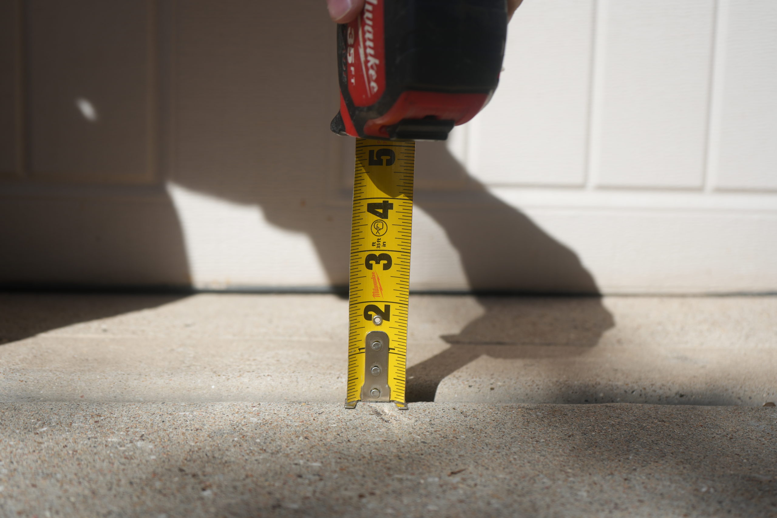 Concrete near garage door - Even