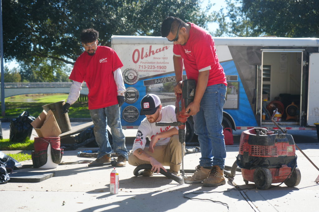Olshan crew leveling driveway concrete