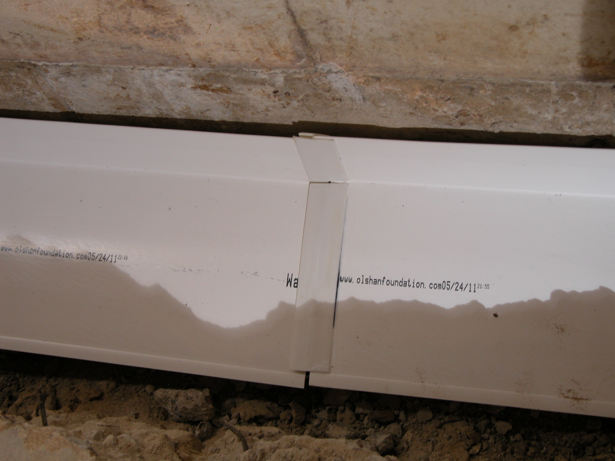High-quality moisture barrier installation along a basement wall, ensuring long-term water resistance and foundational safety High-quality moisture barrier installation along a basement wall, ensuring long-term water resistance and foundational safety