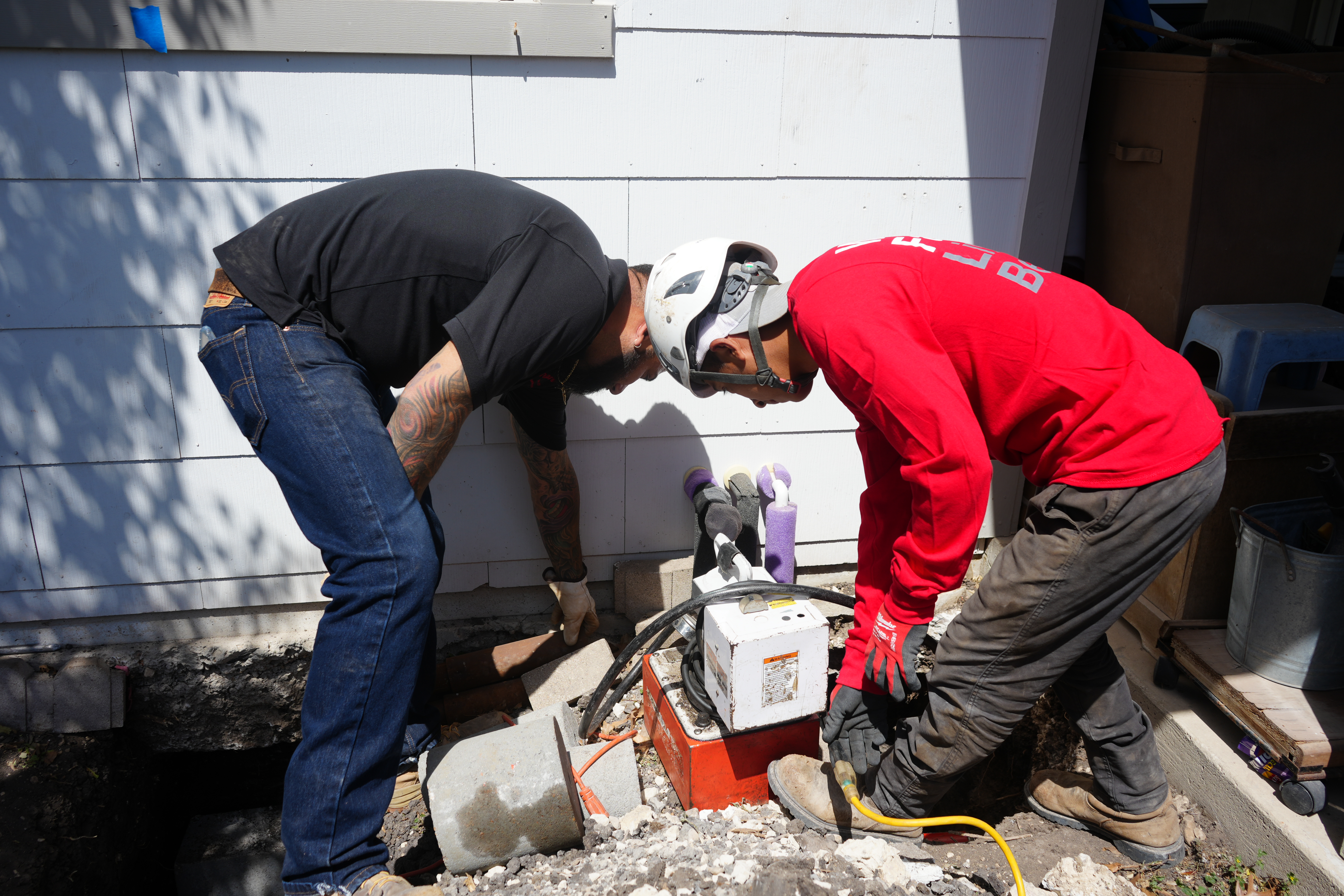 Olshan team conducting foundation leveling and support installation. Olshan team conducting foundation leveling and support installation.