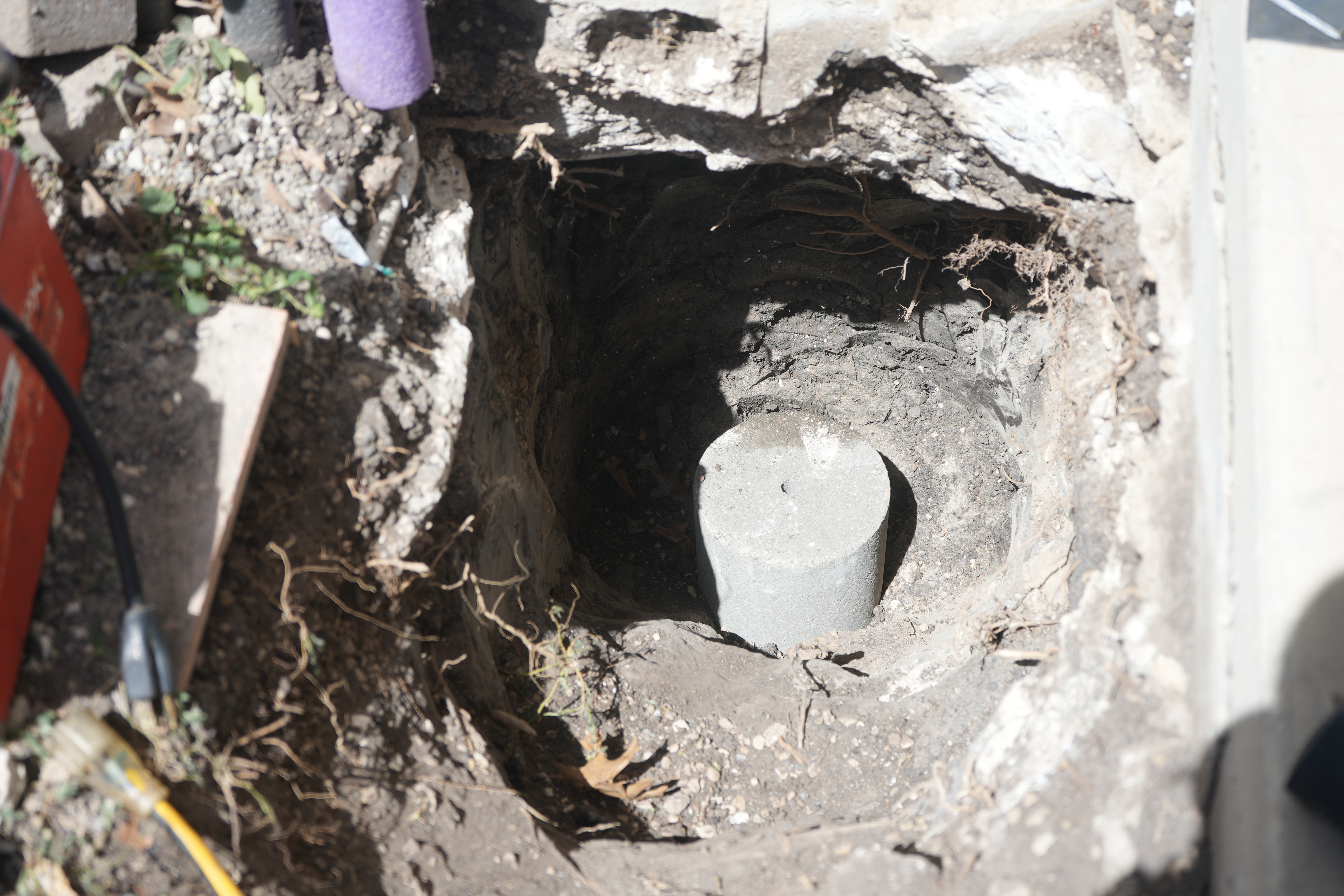 Cable A CableLock concrete section being inserted into the ground.
