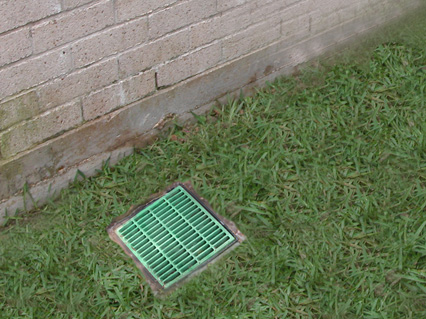 Efficiently positioned drain cover installed to enhance water management and protect residential property from water damage Efficiently positioned drain cover installed to enhance water management and protect residential property from water damage