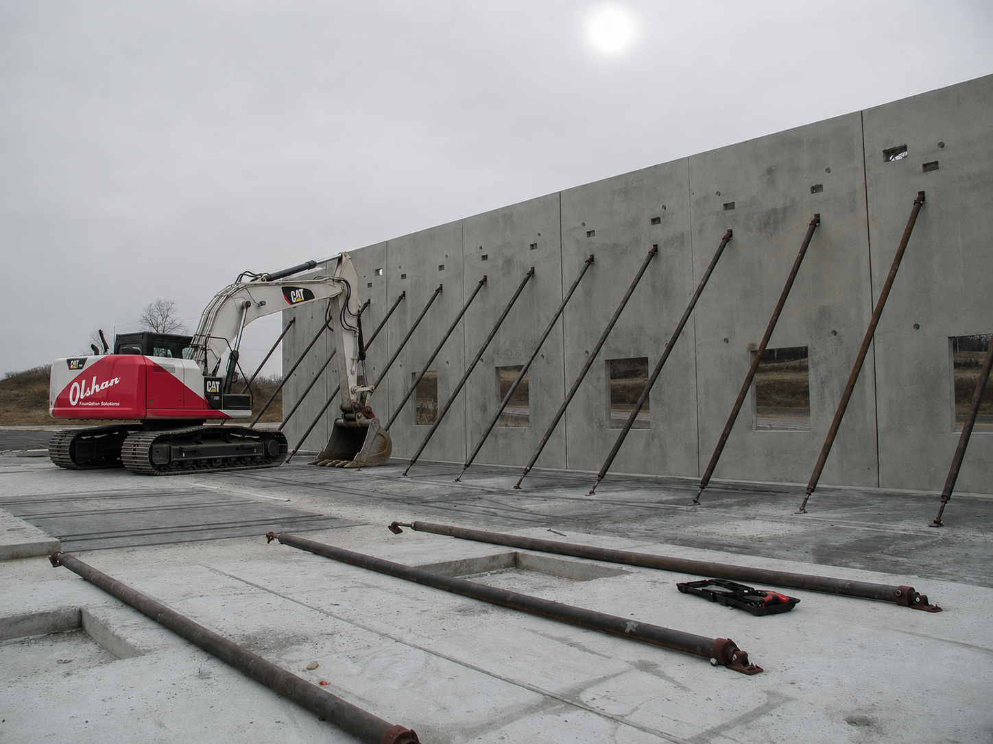 Olshan crew stabilizing braced tilt wall panels